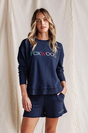 A model wearing the Elements Simplified Confetti Cotton Crew in colour Navy (Blue), from the front, showing the whole outfit