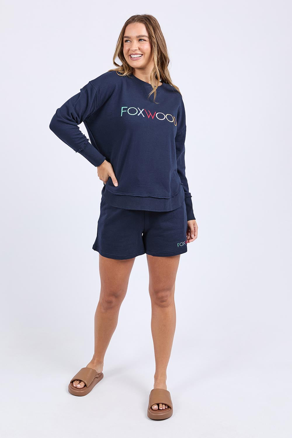A model wearing the Elements Simplified Confetti Cotton Crew in colour Navy (Blue), from the front, showing the whole outfit