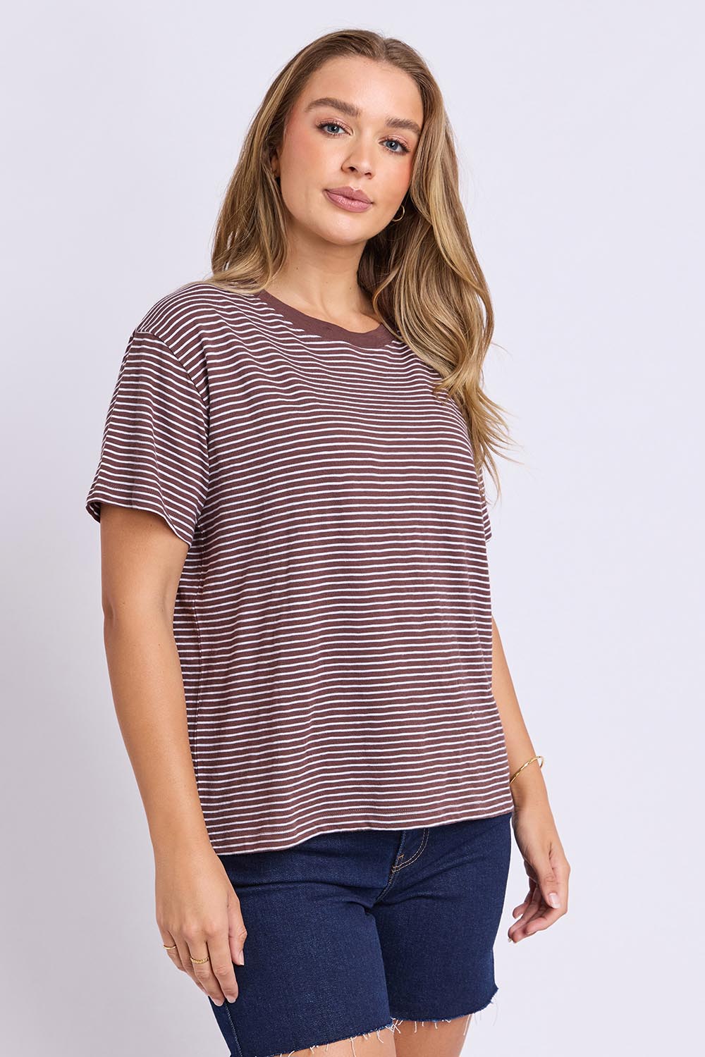 Model Genericm wearing size sample of the Elements Hutch Stripe Cotton Tee – Chocwhite in colour Chocwhite, from an angle