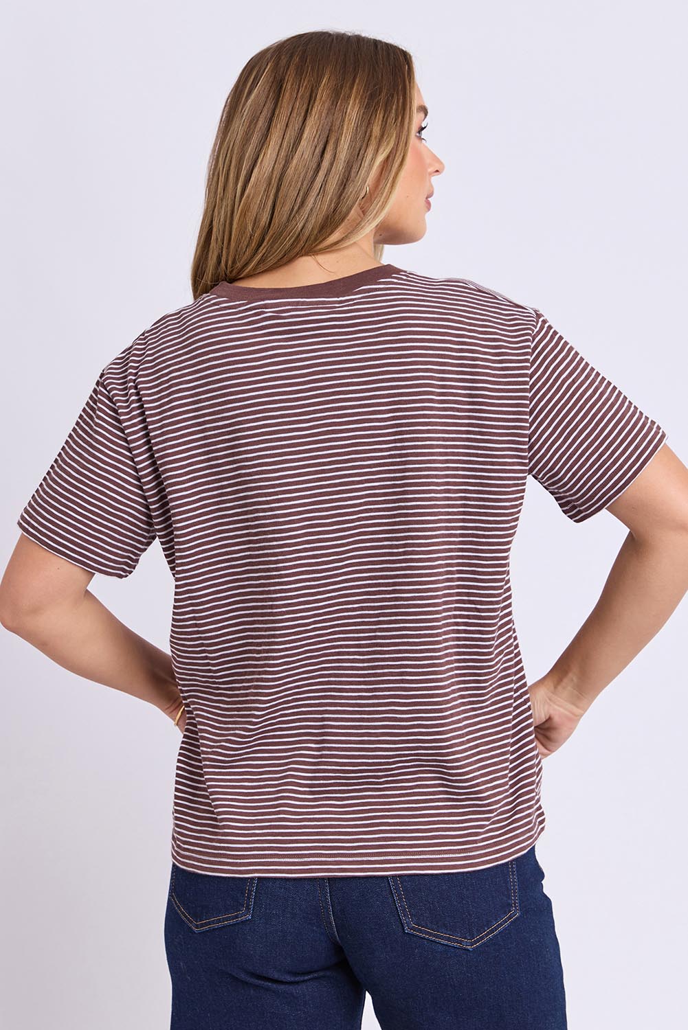 Model Genericm wearing size sample of the Elements Hutch Stripe Cotton Tee – Chocwhite in colour Chocwhite, from the back