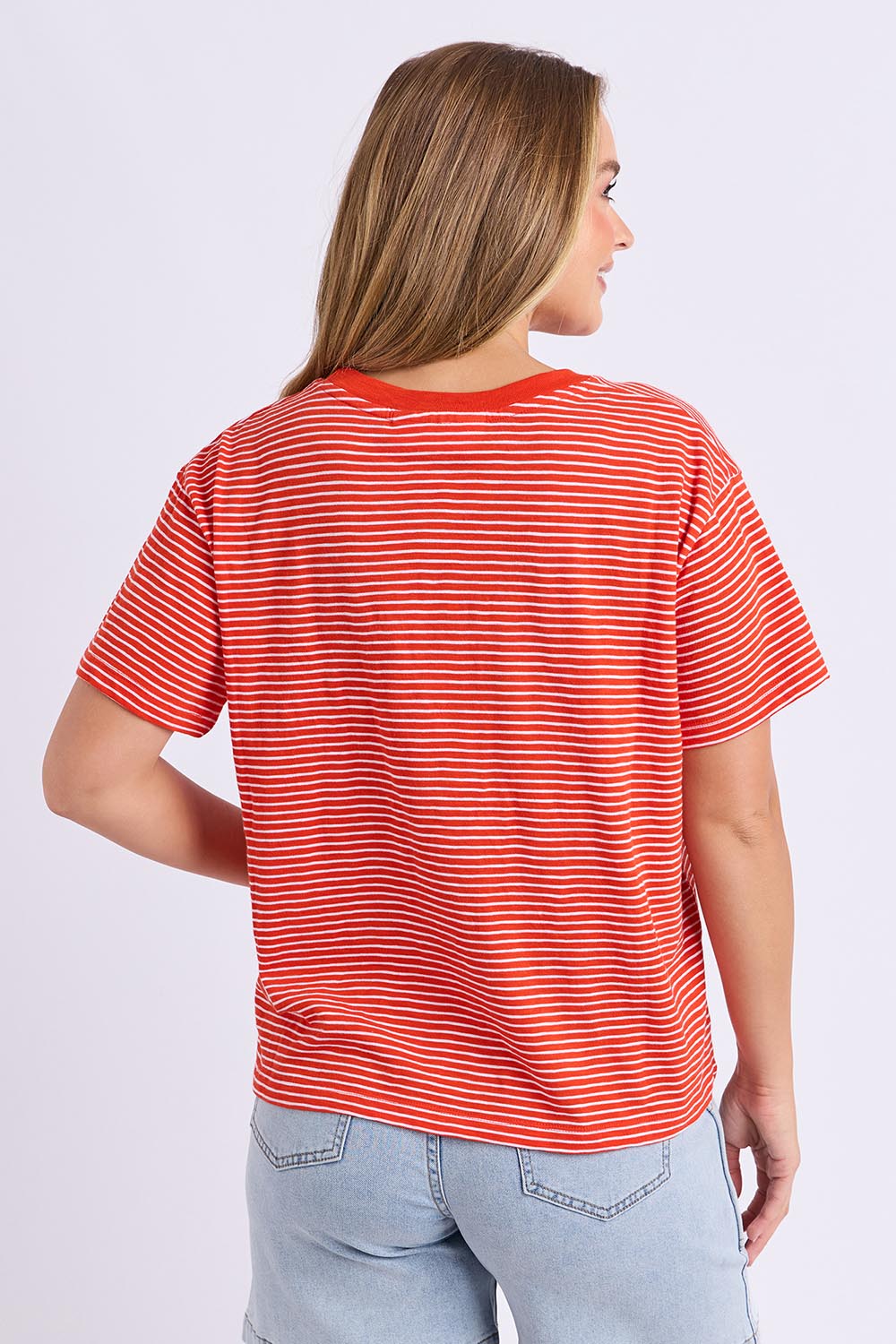 Model Genericm wearing size sample of the Elements Hutch Stripe Cotton Tee – Grenadine in colour Grenadine, from the back