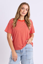 Model Genericm wearing size sample of the Elements Hutch Stripe Cotton Tee – Grenadine in colour Grenadine, in a cropped view