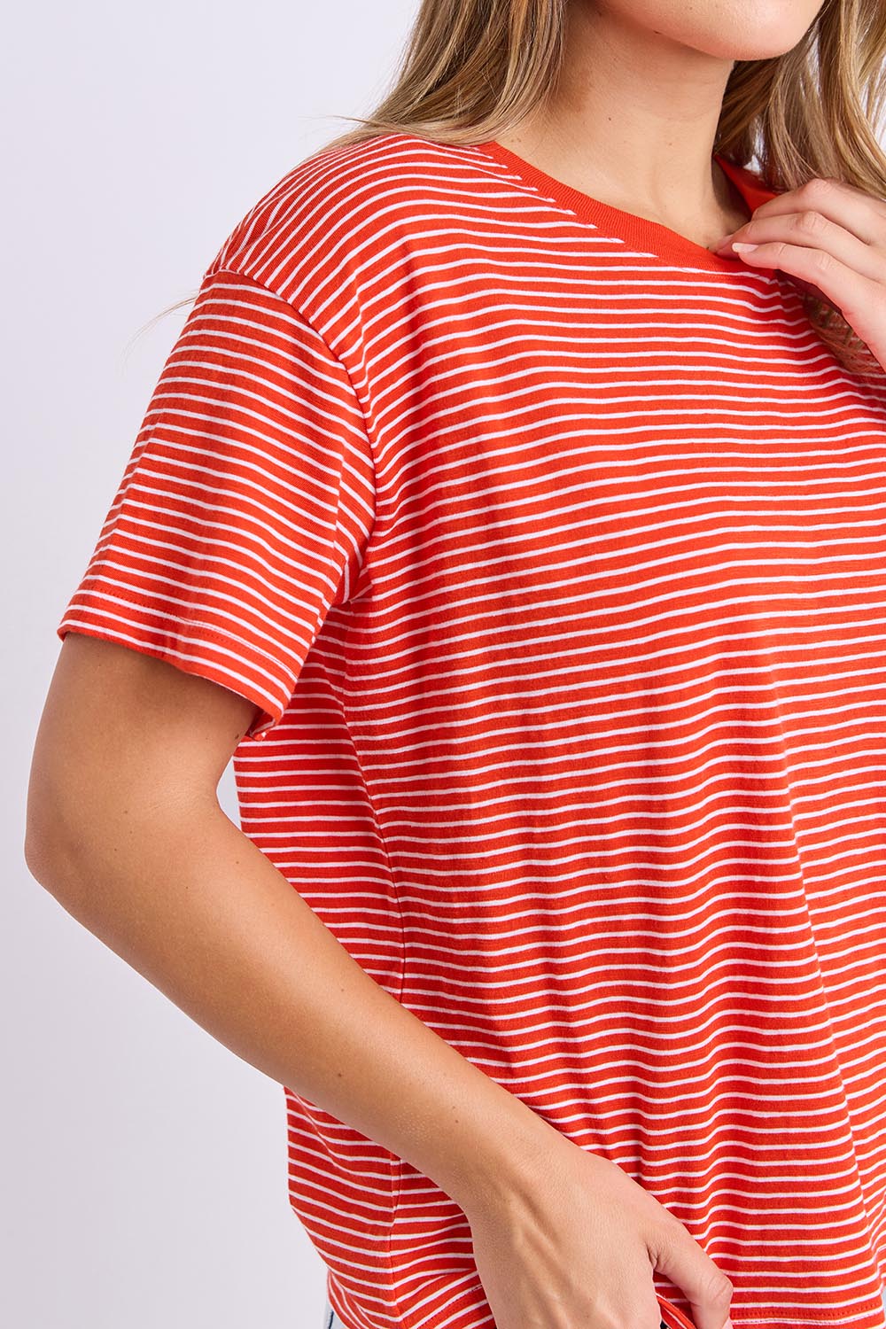 Model Genericm wearing size sample of the Elements Hutch Stripe Cotton Tee – Grenadine in colour Grenadine, in a cropped view