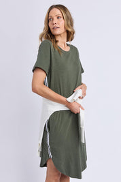 A model wearing the Elements Bay Tape Cotton Tee Dress in colour Khaki (Green), from the front, cropped image