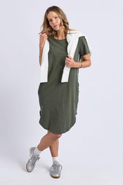 A model wearing the Elements Bay Tape Cotton Tee Dress in colour Khaki (Green), from the front, showing the whole outfit