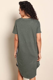 Model Pamelar wearing size 10 of the Elements Bay Tape Cotton Tee Dress - Khaki in colour Khaki, from the back
