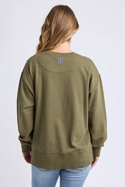 A model wearing the Elements Effortless Contrast Cotton Crew in colour Wintermoss (Green), from the back