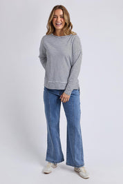 A model wearing the Elements Eddie Stripe Long Sleeve in colour Blackwhite (Black), from the front, showing the whole outfit