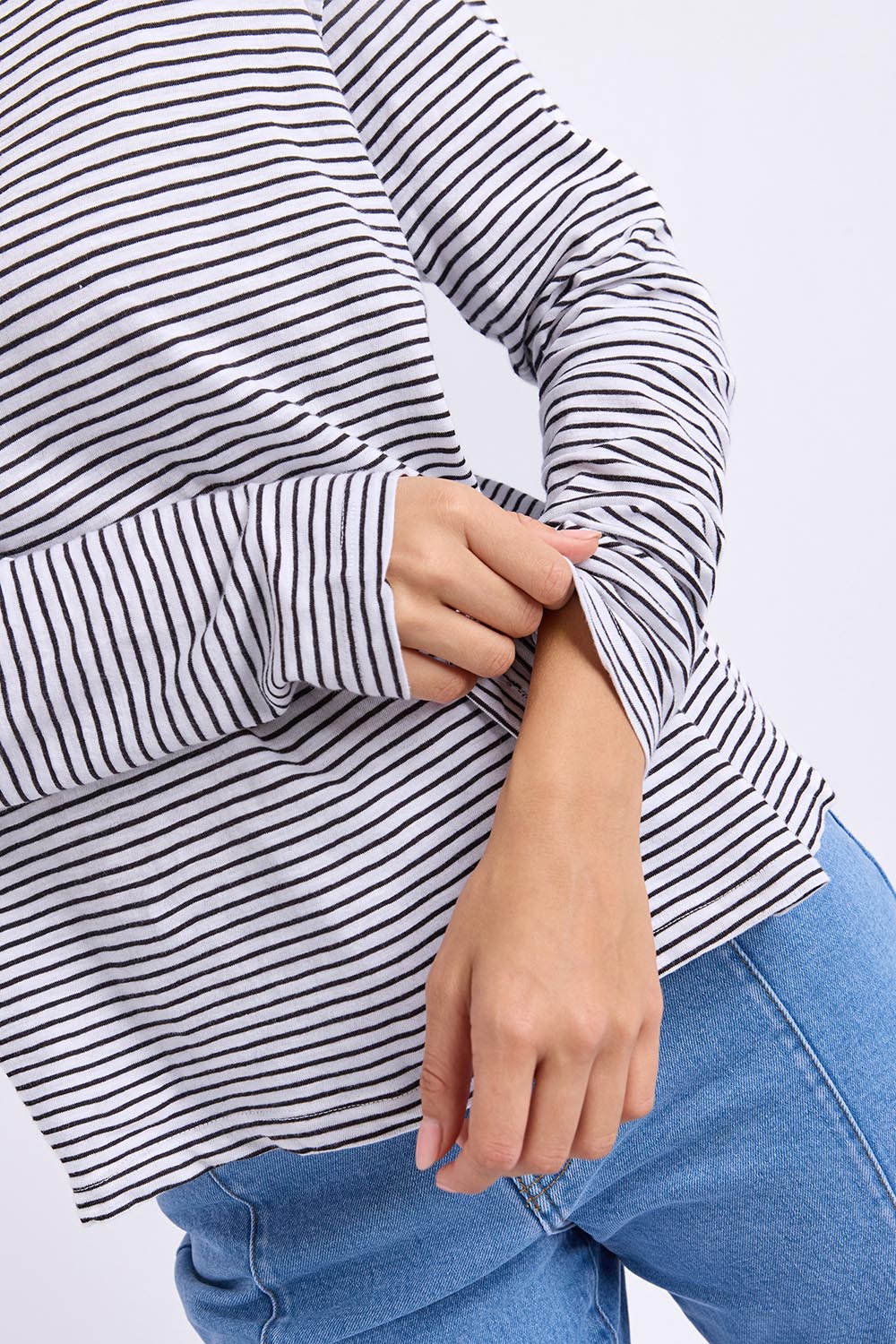 Model Genericm wearing size sample of the Elements Hutch Stripe Cotton Long Sleeve Tee - Whiteblack in colour Whiteblack, from an angle