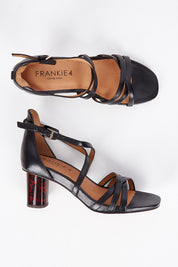 A model wearing size 7 of the Abi Leather Heel in colour Black (Black), from the front, showing the whole outfit