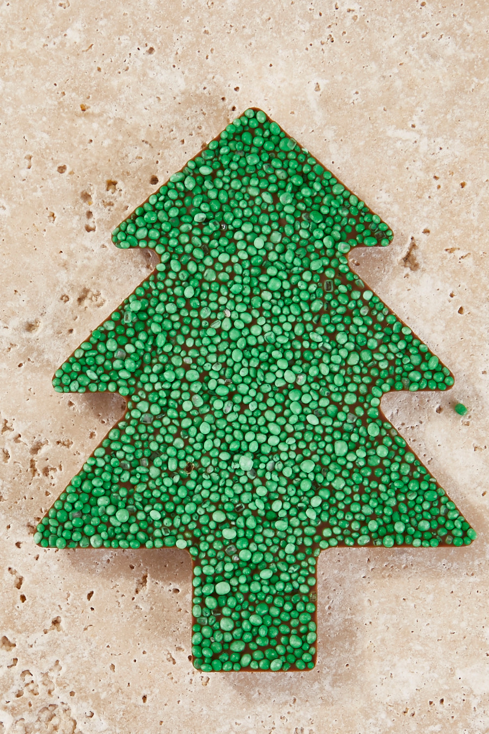 A model wearing the Freckle Tree in colour Green (Green), from the front, showing the whole outfit