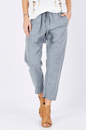 Model Maddy wearing size 10 of the Lalla Pants in colour BlueIllu (Blue), from the front, cropped image