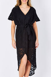 Model Maddy wearing size 10 of the Maylou Tie Waist Maxi Dress in colour BlackAntiq (Black), from the front, cropped image