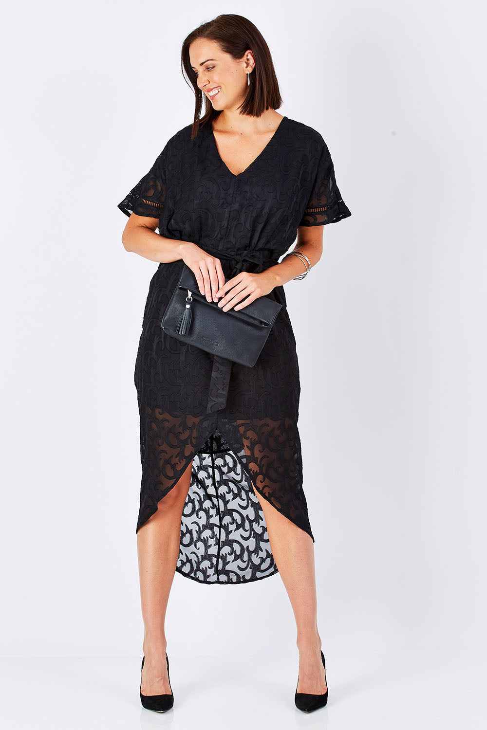 Model Perrie wearing size 10 of the Maylou Tie Waist Maxi Dress in colour BlackAntiq (Black), from the front, showing the whole outfit