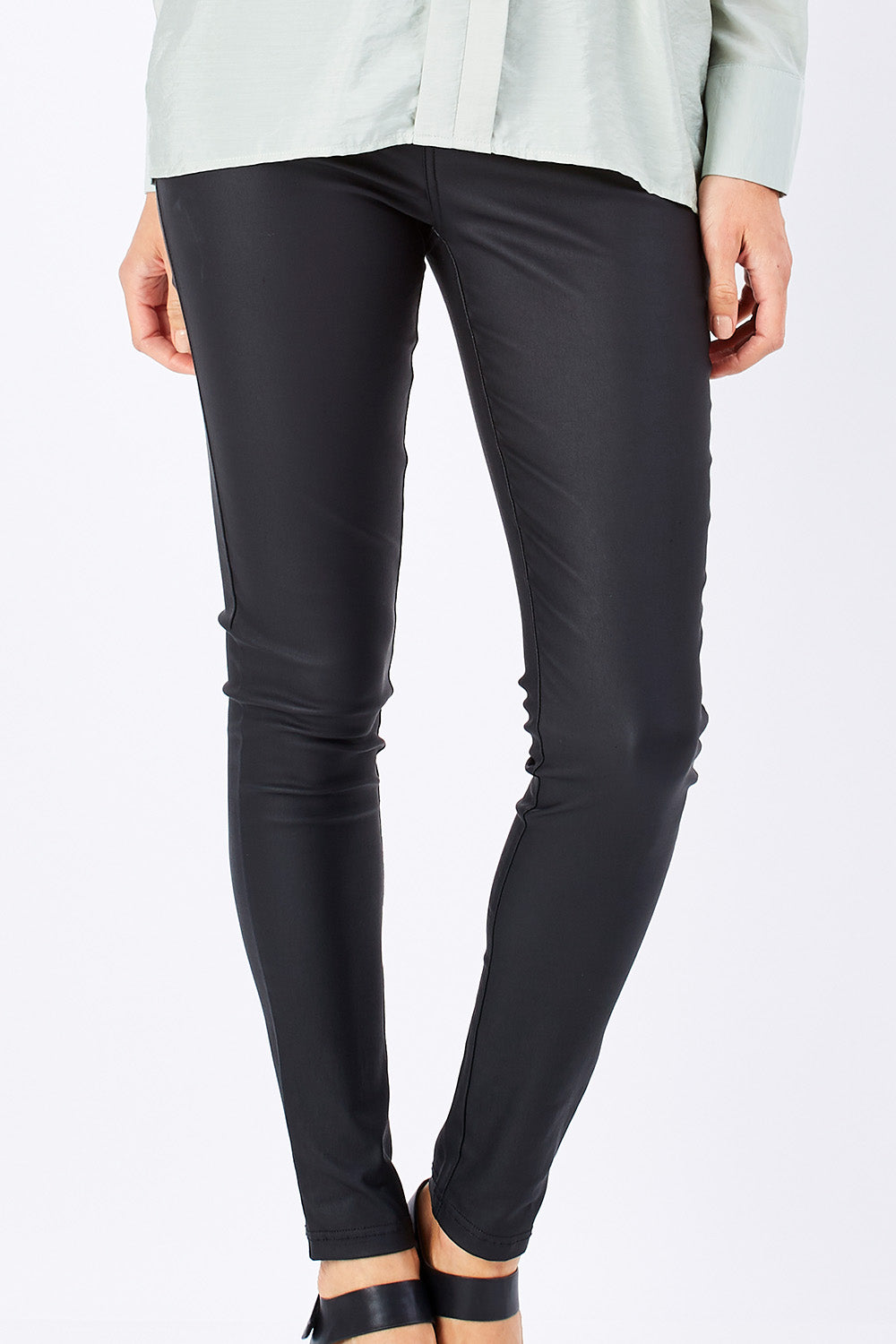 Model Rebecca wearing size 10 of the Ynez Essential Coated Pant in colour Black (Black), from the front, cropped image