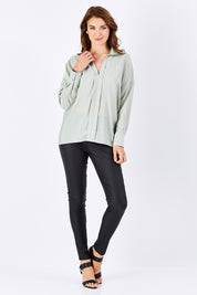 Model Rebecca wearing size 10 of the Ynez Essential Coated Pant in colour Black (Black), from the front, showing the whole outfit
