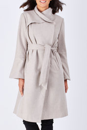 Model Perrie wearing size 10 of the Maniaa Long Coat in colour Chestnut, from the front, cropped image