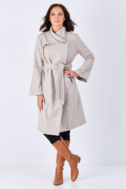 Model Perrie wearing size 10 of the Maniaa Long Coat in colour Chestnut, from the front, showing the whole outfit