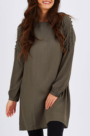 Model Chesska wearing size 10 of the Flora Buttoned Sleeve Dress in colour Khaki (Green), from the front, cropped image