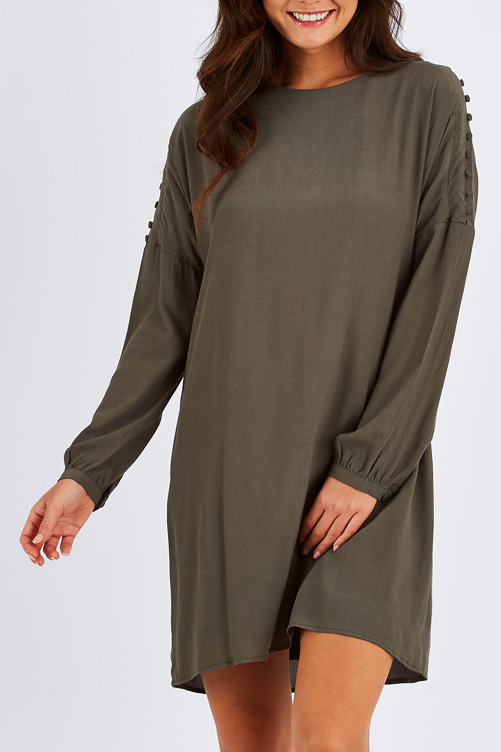Model Chesska wearing size 10 of the Flora Buttoned Sleeve Dress in colour Khaki (Green), from the front, cropped image