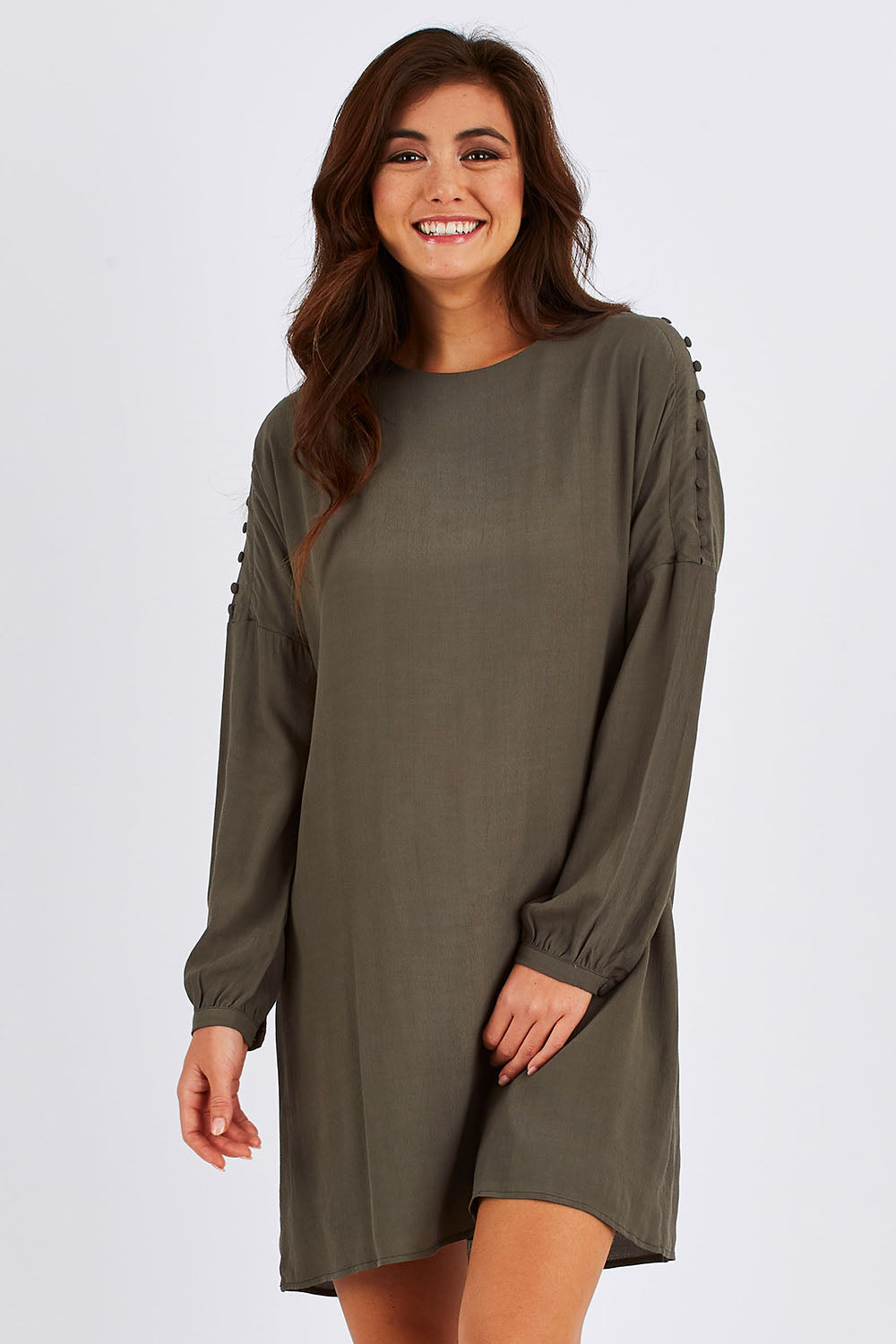 Model Chesska wearing size 10 of the Flora Buttoned Sleeve Dress in colour Khaki (Green), from the front, cropped image