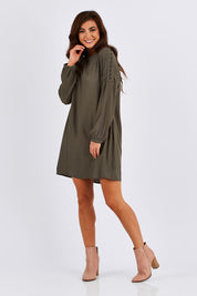 Model Chesska wearing size 10 of the Flora Buttoned Sleeve Dress in colour Khaki (Green), from the front, showing the whole outfit