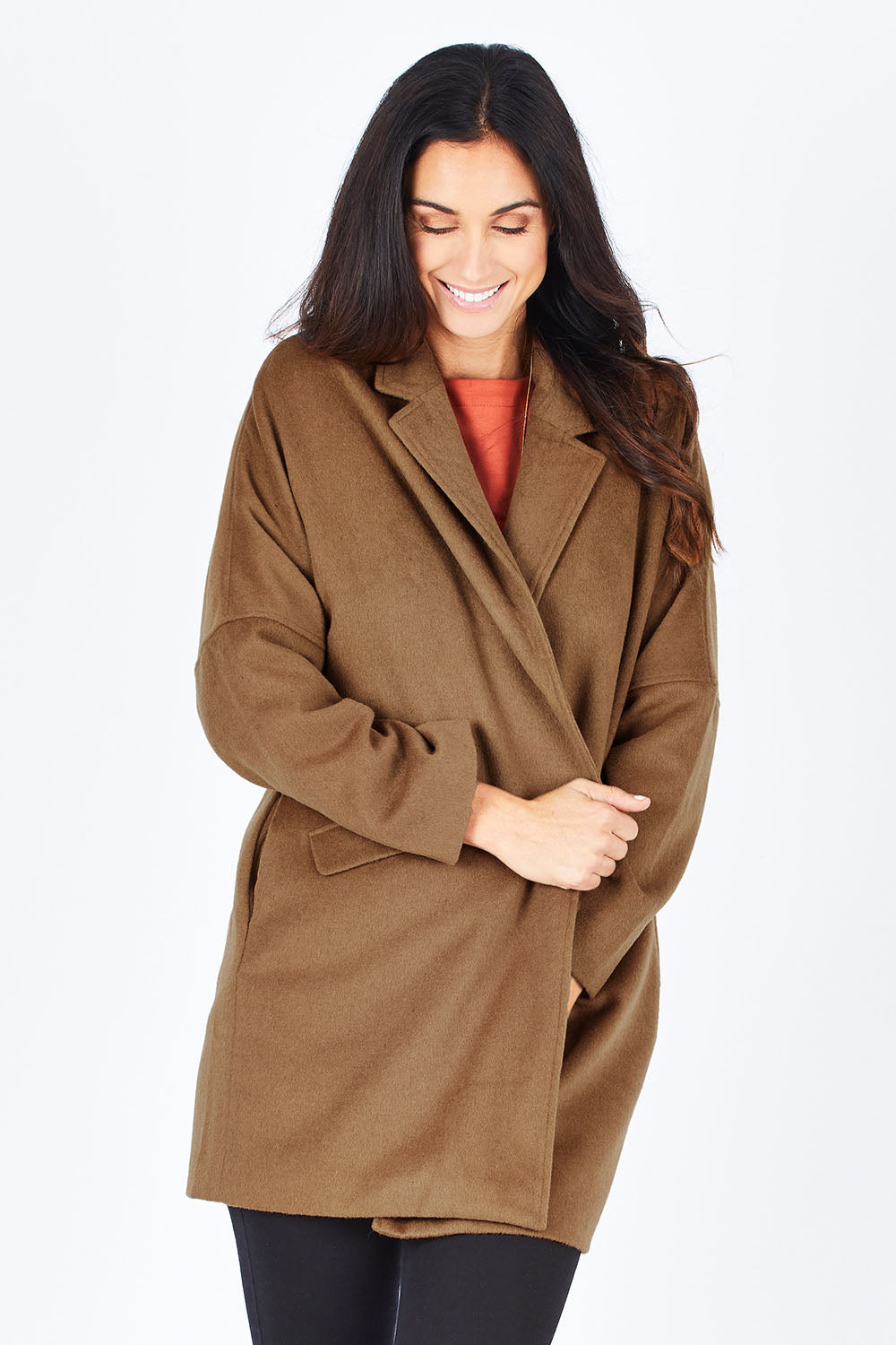 Model Gemma wearing size S of the Ascot Coat in colour Caramel, from the front, cropped image
