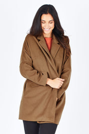 Model Gemma wearing size S of the Ascot Coat in colour Caramel, from the front, cropped image