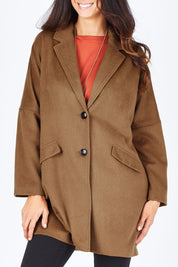Model Gemma wearing size S of the Ascot Coat in colour Caramel, from the front, cropped image