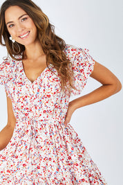 Model Madeline wearing size 10 of the Love Game Maxi Dress in colour Toykoblues (White), from the front, cropped image