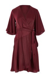 Product shot of the Roula Wrap Dress in colour Portwine (Red), from the front