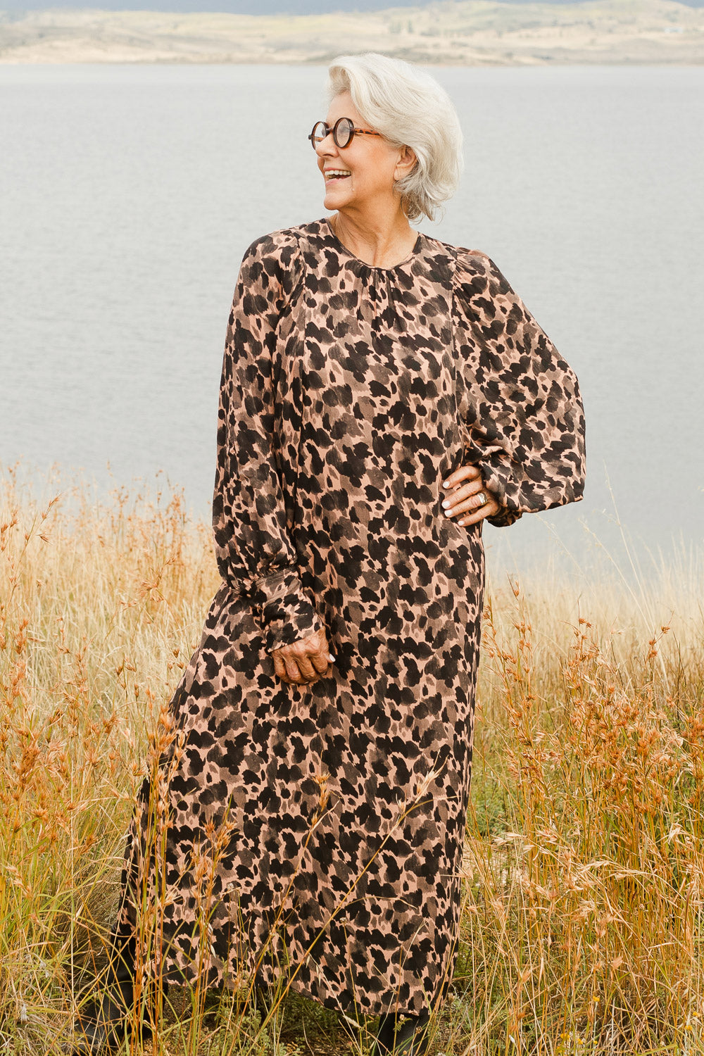 Model Elise wearing size 10 of the Bound For Glory Dress in colour Abstractan (Black), from the front, showing the whole outfit