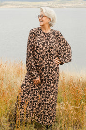 Model Elise wearing size 10 of the Bound For Glory Dress in colour Abstractan (Black), from the front, showing the whole outfit