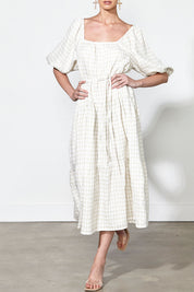 A model wearing the Soul Love Linen Dress in colour Boneging, from the front, cropped image