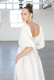 A model wearing the Soul Love Linen Dress in colour Boneging, from the front, showing the whole outfit