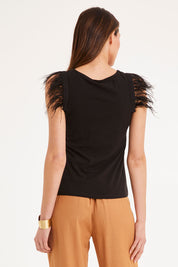 Model Madeline wearing size 10 of the Enchanted Top in colour Black (Black), from the back