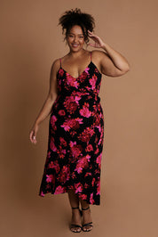 Model Alexis wearing size 16 of the Walk Away Dress in colour Punchflora (Black), from the front, showing the whole outfit