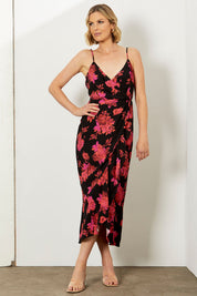 A model wearing the Walk Away Dress in colour Punchflora (Black), from the front, showing the whole outfit