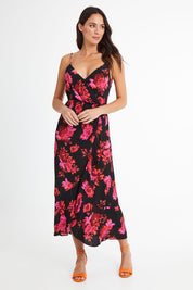 Model Madeline wearing size 10 of the Walk Away Dress in colour Punchflora (Black), from the front, showing the whole outfit