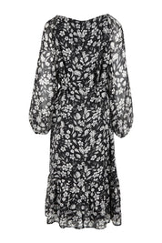 Product shot of the Beautiful Soul Frill Hem Midi Dress in colour Monofloral (Black), from the back