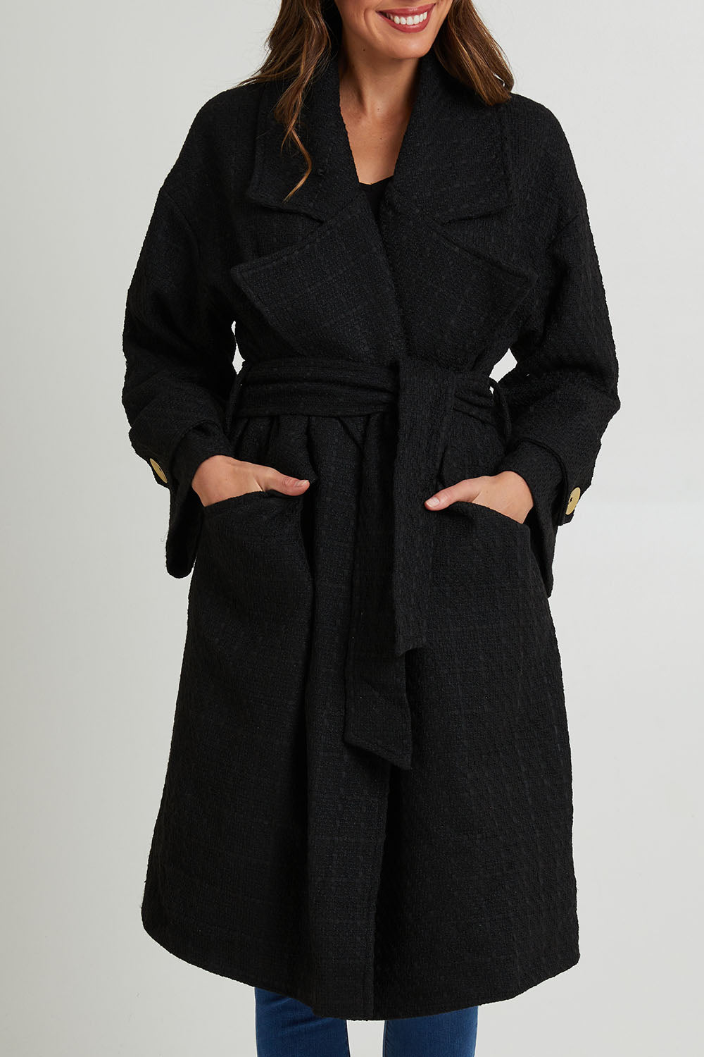 Model Madeline wearing the Forever Oversized Coat in colour Black (Black), from the front, cropped image