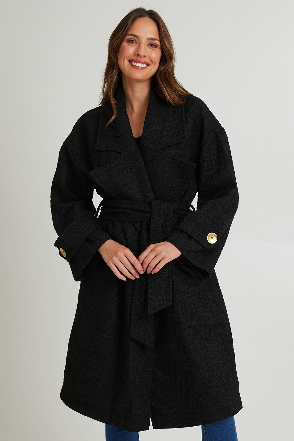 Model Madeline wearing the Forever Oversized Coat in colour Black (Black), from the front, cropped image