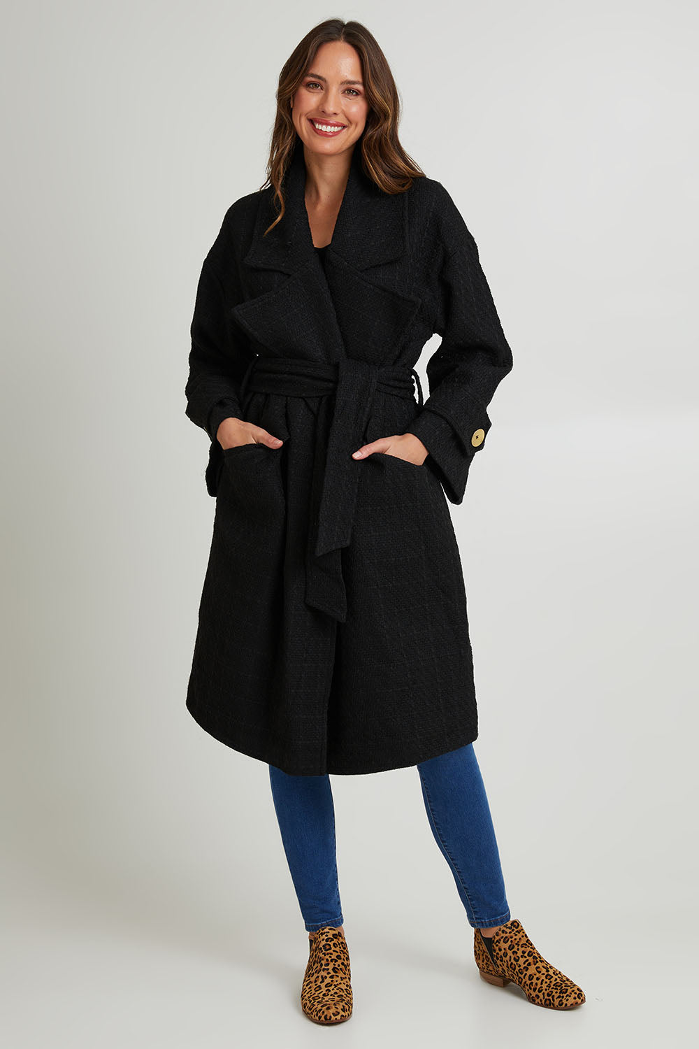 Model Madeline wearing the Forever Oversized Coat in colour Black (Black), from the front, showing the whole outfit