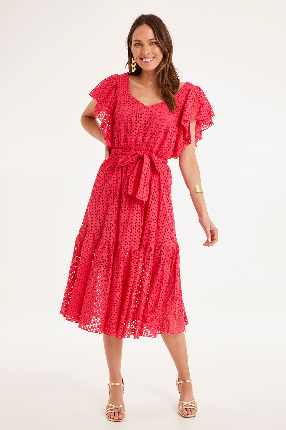 Model Madeline wearing size 10 of the Dream Lover Broderie Midi Dress in colour Rubypink (Pink), from the front, showing the whole outfit