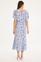 Model Madeline wearing size 10 of the Sweet Harmony Midi Dress in colour White (White), from the back