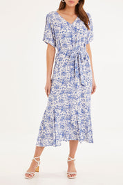 Model Madeline wearing size 10 of the Sweet Harmony Midi Dress in colour White (White), from the front, cropped image