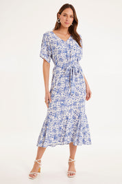 Model Madeline wearing size 10 of the Sweet Harmony Midi Dress in colour White (White), from the front, showing the whole outfit