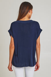 Model Madeline wearing size 10 of the Junos Knit in colour Navy (Blue), from the back