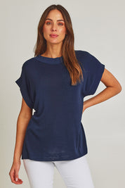 Model Madeline wearing size 10 of the Junos Knit in colour Navy (Blue), from the front, cropped image