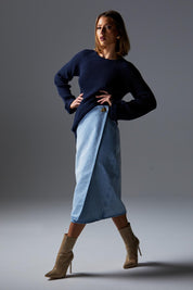A model wearing the Flight Denim Wrap Skirt in colour Wash (Blue), from the front, showing the whole outfit